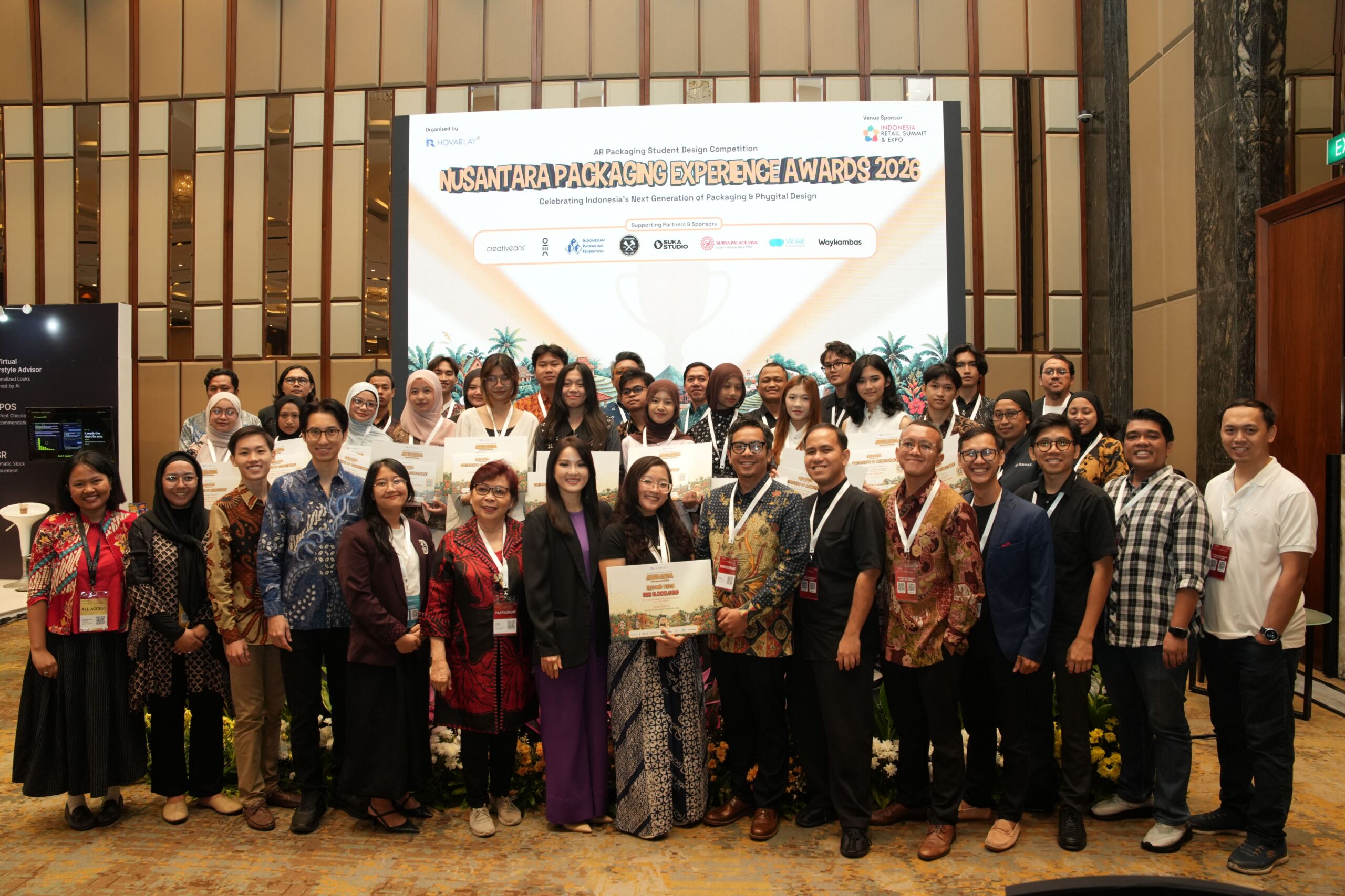 Group of diverse professionals posing with certificates at the Nusantara Packaging Experience Awards 2026 event.