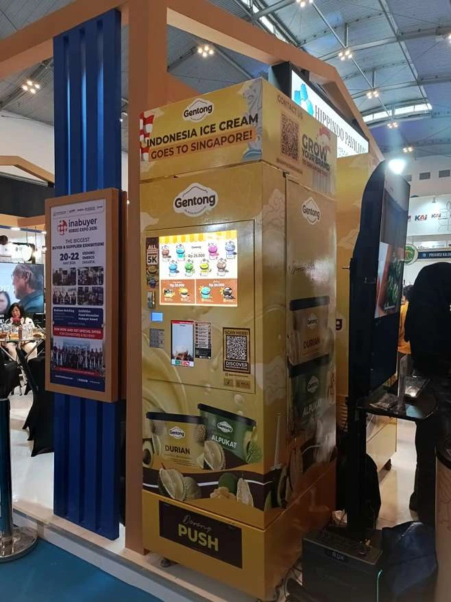 Promotional ice-cream vending display at a trade show, advertising Gentong Indonesia Ice Cream with the slogan 'Indonesia Ice Cream Goes to Singapore!'